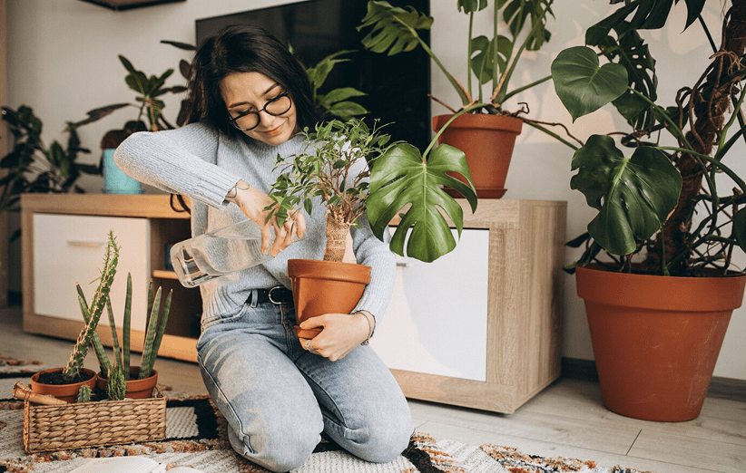 young-woman-cultivating-plants-home_1303-22937 1